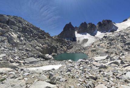 Near the top of Aasgard Pass there is a small lake below the steep Dragontail Peaks (credit: Chris Rapp)