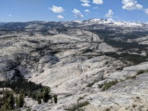 The vista is only a few minute hike from the junction and is well worth the effort. This is the view looking northwest at Tenaya Creek cascades through the canyon with snow peaks in the background.