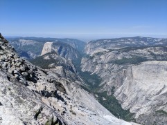 View from Clouds Rest looking into the Tenaya Canyon and Yosemite Valley and showing Half Dome and Mount Watkins