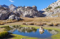 There is a small lake near the 1.3 mile mark along the Titcomb Basin Trail. This is shortly before the trail reaches Lake 10,548.