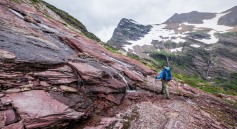 Passing one of several waterfalls along the Gunsight Pass Trail in Glacier National Park (credit: John Strother)